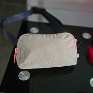 Lululemon Athletica Minie Belt Bag Trench Beige Crossbody Bag with Pink Accents